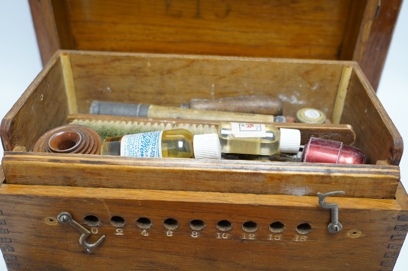 A collection of watch parts, tools and a small selection of costume jewellery, housed in two cases, together with two books. Condition - poor to fair